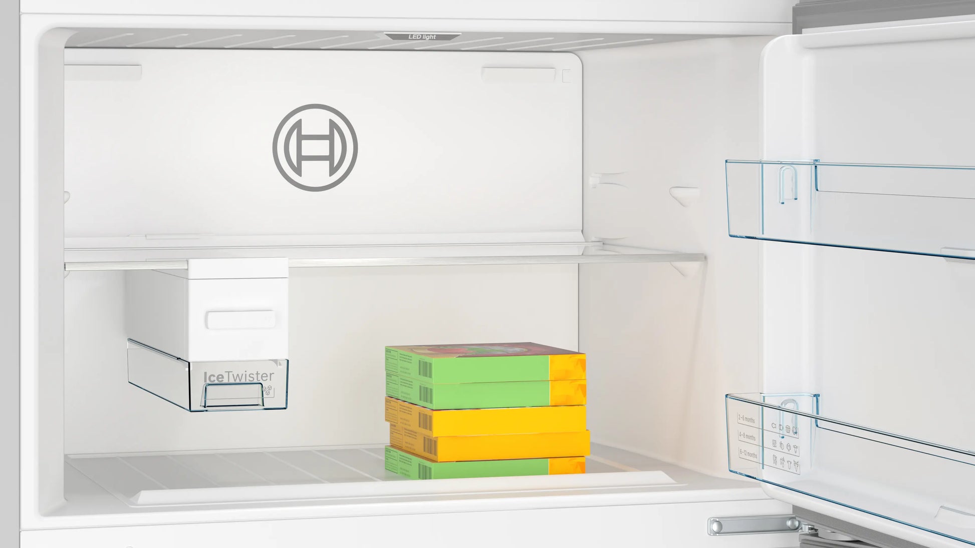Open refrigerator with colorful boxes inside, featuring a brand logo on the door.