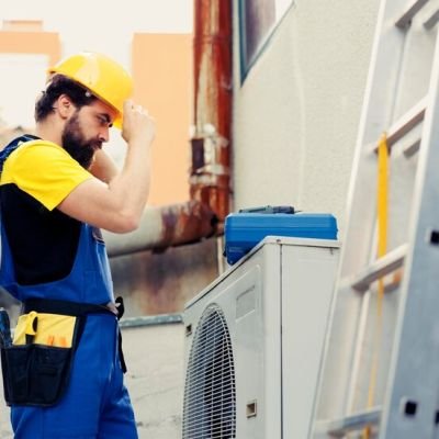 skilled-electrician-contracted-check-up-outdoor-air-conditioner-starting-work-shift-trained-worker-wearing-protective-gear-preparing-service-faulty-external-hvac-system_482257-63954